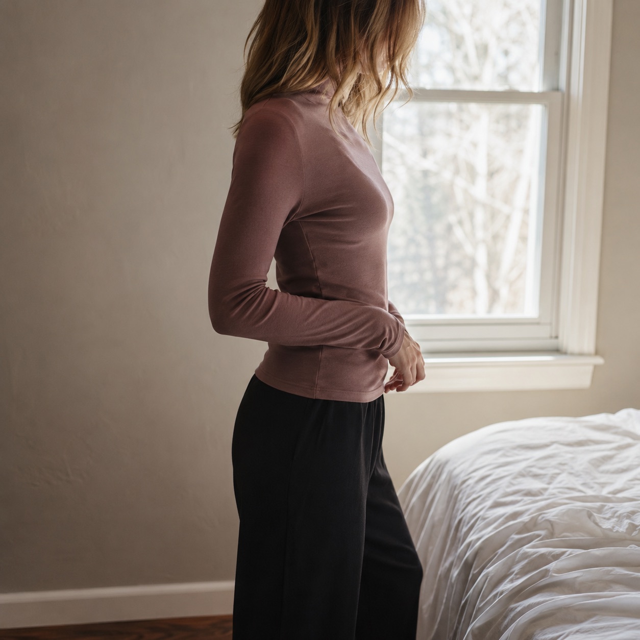 Elstead high-neck long-sleeve base layer — Long-Sleeve Base Layers by FITS LIKE. worn by a model, side view.