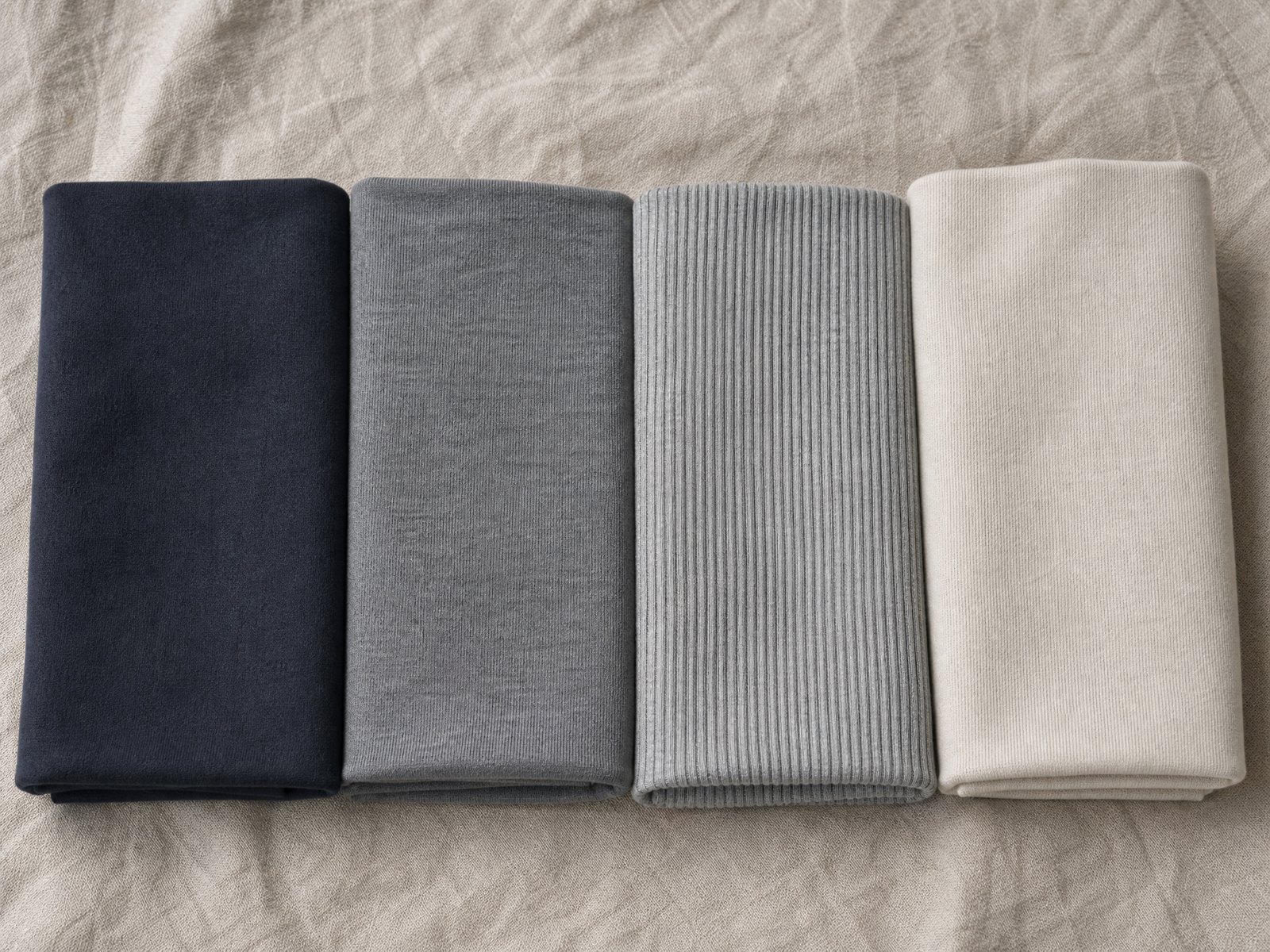 Four cones of yarn in merino, lambswool, cotton and bamboo viscose